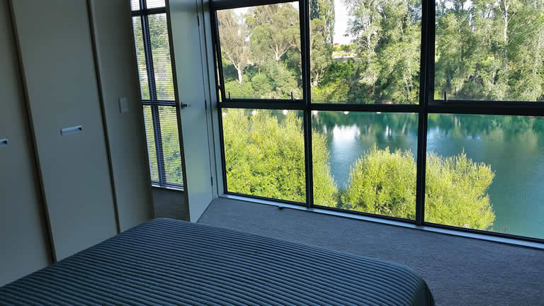 Wake to water views from Riverside Apartment Taupo